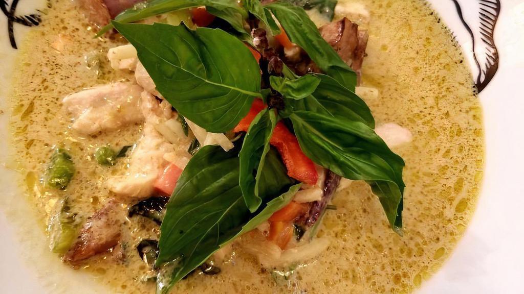 Green Curry · Mild spicy. Coconut milk, basil, pepper, bamboo shoot, eggplant with green curry.