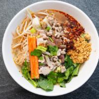 Tom Yum Noodle Soup · With ground pork, fish ball and pork liver.