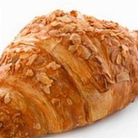 Almond Croissant · Topped with sliced almonds and honey.