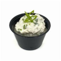 Side: Scallion Cream Cheese (4Oz) · 4oz side of our housemade scallion cream cheese. Vegan, gluten-free, nut-free. Contains soy.