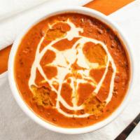 Dal Makhani · Black gram and soybean seeds cooked with butter and Indian spices.