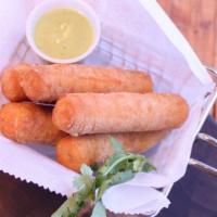 Tequenos · Fresh cheese wrapped in dough, deep fried.