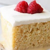 Tres Leches Cake · Traditional cake soaked in three different milks.