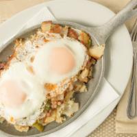 Leprechaun Breakfast · Two basted eggs, corned beef hash, onions, peppers, home fries and Cheddar. Served with an E...