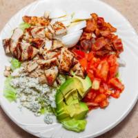 Cobb Salad · Grilled chicken, lettuce, tomato, crumbled Blue cheese, bacon, hard boiled egg, avocado, wit...
