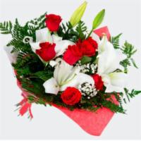 Bouquet Of Red Roses And Lilies · 7 red roses and 2 stems of Holland lilies wrapped nicely in a bouquet.