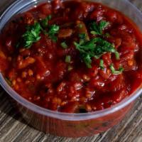 Madboukha (8Oz) · Spicy cooked tomato relish straight from grandma's cookbook