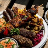 Mixed Grill Platter · Beef & Lamb Kebabs(2), Chicken Skewer(1) Chicken Shawarma and Merguez Sausage(2) w/ Israeli ...