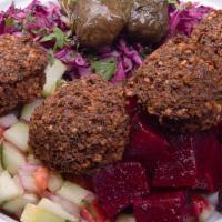 Mediterranean Feast · A healthy serving of hummus w/ warm chickpeas, w/ Israeli salad, red cabbage salad, beets sa...