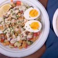 Premium Israeli Salad · w/ tahini, warm chickpeas, pine nuts and hard boiled egg