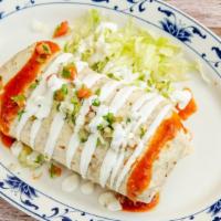 Super Burro · Rolled flour tortilla stuffed w/ beans beef or chicken w/ a touch of red sauce & sour cream.