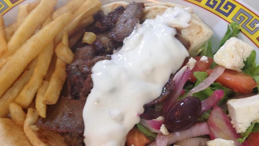 Greek Gyro Platter With Greek Salad Platter · Served with Greek salad, pita bread, and tzatziki sauce.