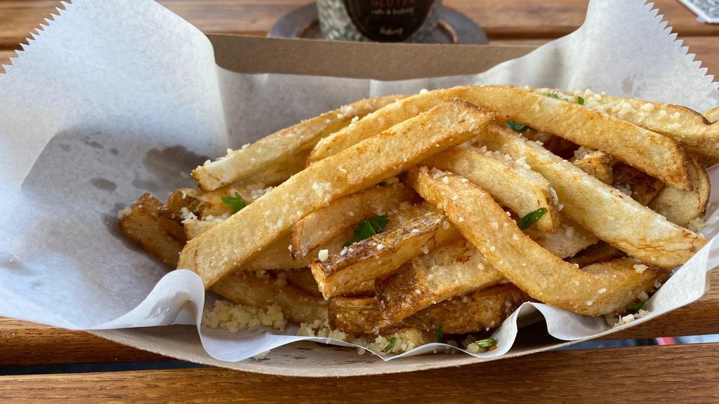 Hand-Cut Fried Potato With Parmesan Cheese & White Truffle Oil · Hand-cut Idaho potatoes with skin on, fried in 100% canola oil. Served with parmesan cheese and white truffle oil.