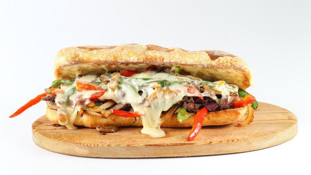 Pesto Chicken Philly · Fresh grilled chicken with pesto sauce and mozzarella cheese stuffed in between fresh-baked bread.
