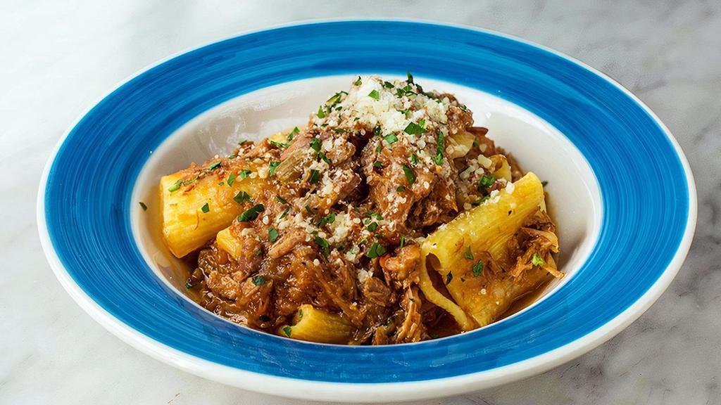Paccheri Genovese · Homemade Jumbo rigatoni with slow cooked onion ragu, veal and Parmigiano reggiano.