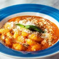 Gnocchi Sorrentina · Homemade potato dumplings with tomato sauce, mozzarella, Parmigiano reggiano and basil.