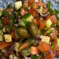 Shepherd Salad · Cucumber, red onion, green pepper, kalamata olives, mint, parsley, tomatoes, lemon, pomegran...
