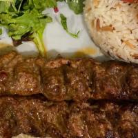 Adana Kebab · 2 skewers of finely chopped lamb mixed with red bell pepper & fresh herbs served with rice a...
