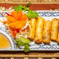 Vegetable Spring Roll · Deep-fried spring rolls filled with glass noodles, 
vegetables, and tofu, served with turnip...