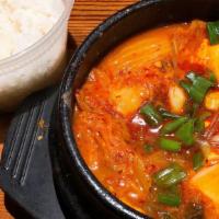 Army Stew (Budae Jjigae) · Army base stew with sausage, spam, pork belly, vegetables, and ramen noodles. Option of spic...
