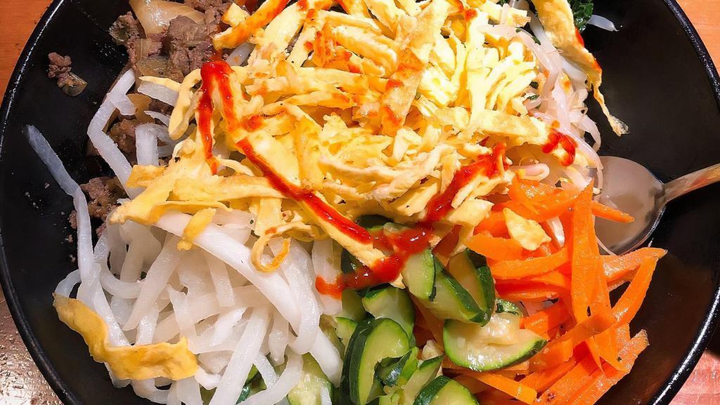 Beef (Bulgogi) Bibimbap · Bowl of warm white rice topped with various namul (assorted vegetables), beef, and topped with an egg.