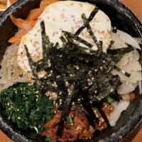 Spicy Pork Bibimbap · Spicy. Served as a bowl of warm white rice topped with various namul (assorted vegetables), ...
