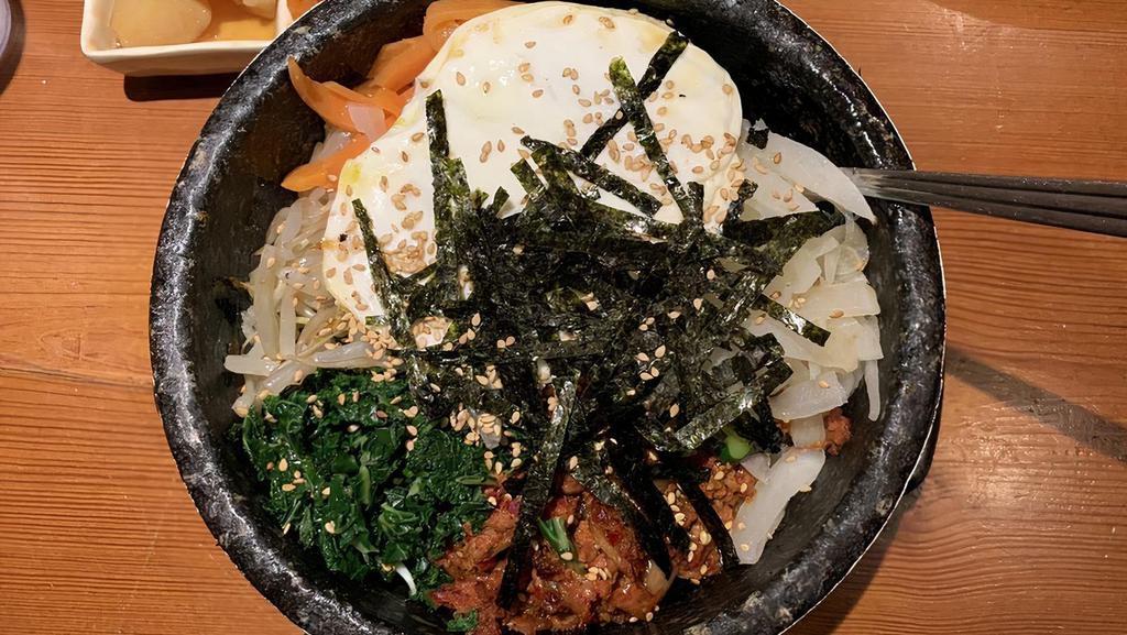 Spicy Pork Bibimbap · Spicy. Served as a bowl of warm white rice topped with various namul (assorted vegetables), spicy pork, and topped with an egg.