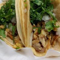 Pollo / Chicken · Corn tortillas with onions, cilantro and your choice of meat.