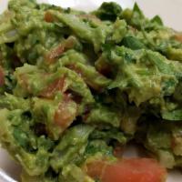 Guacamole · with chips for an additional charge.