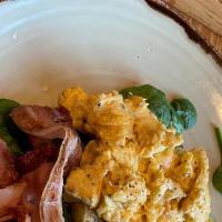 2 Scrambled Eggs With Choice Of Meat · Get the classic Mexican breakfast with rice and beans and your choice of ham, chorizo, or sa...