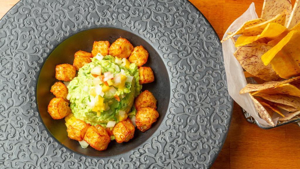 Guacamole · Avocado, queso Blanco and assorted Caribbean chips.