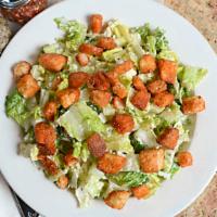 Caesar Salad · House specialty. Crisp romaine topped with homemade garlic croutons, aged parmesan cheese an...