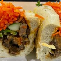 Grilled Pork Sandwich · Grilled pork w. mayo, butter, cucumber, julienne carrots and cilantro, served on a toasted f...
