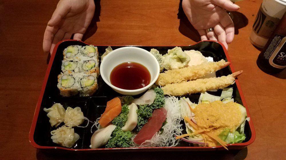 Sashimi Bento Box · Served with miso soup, house salad, shrimp tempura, vegetable tempura, shrimp shumai, white rice, California roll and green tea.