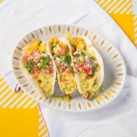 Tijuana Breakfast Tacos · 3 tortillas topped with scrambled eggs, hash browns, cotija cheese, green chili hollandaise ...