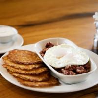 Corned Beef Hash And Eggs · Slow roasted cab corned beef brisket ground in house with onions, potatoes and seasoning, co...