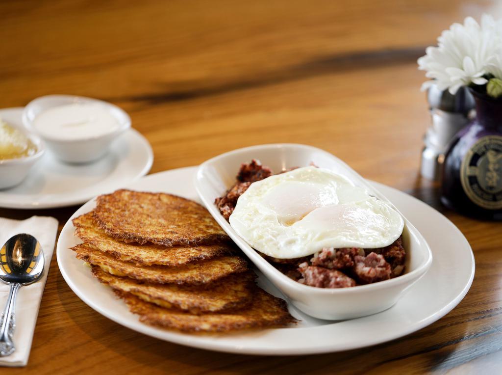 Corned Beef Hash And Eggs · Slow roasted cab corned beef brisket ground in house with onions, potatoes and seasoning, cooked crisp in clarified butter.
