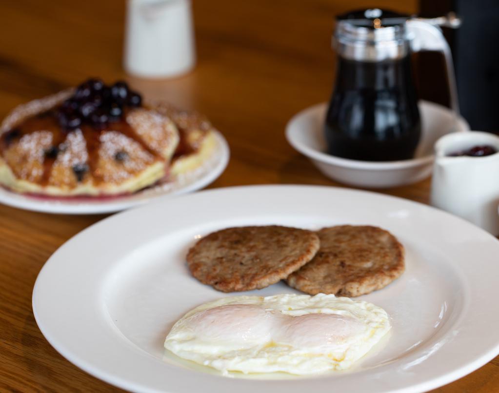 Sausage Patties & Eggs · Two sausage patties and two large fresh eggs served any style. cal 1170. 

Served with your choice of hash browns, toast or pancakes.