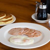 Canadian Bacon & Eggs · Four slices of our sugar-cured Canadian bacon and two large, fresh eggs cooked to order.