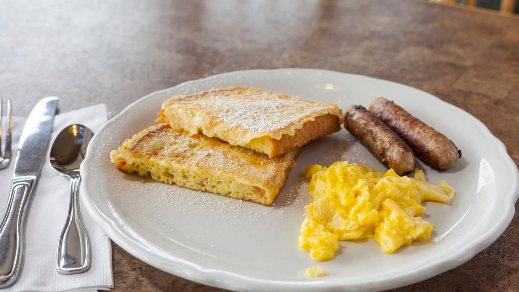 French Toast Plate · Two slices of sourdough french toast with your choice of bacon (2), canadian bacon (2), link sausage (2), or patty sausage (1). Served with one egg any style. Served with a side of maple syrup & whipped butter.