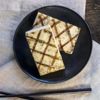 Grilled Organic Tofu · Firm organic tofu with ginger, garlic and sesame oil