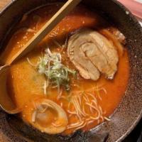 Spicy Tonkotsu · Medium-hot. Pork bone stock. Thin noodle. Pork broth with full flavor creamy texture cooked ...