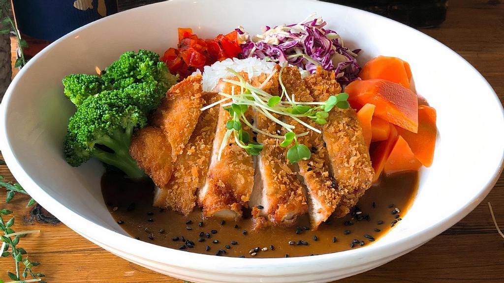 Katsu Curry Don · Panko breaded and fried cutlet with a flavorful brown curry sauce over Japanese short-grain white rice. Served with broccoli, carrots, and fukujinzuke on the side.
