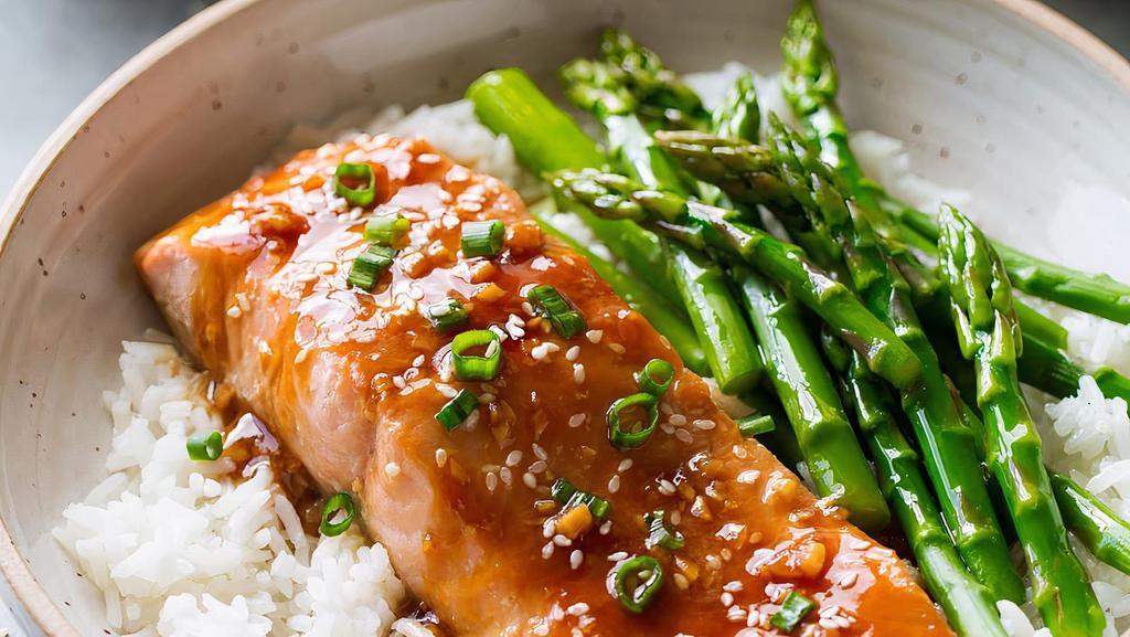 Salmon Teriyaki · Salmon glazed with house teriyaki. Served with broccoli and carrots, sprinkled with sesame seeds over Japanese short-grain white rice. Contains fish.