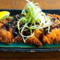 Katsu · Breaded fried chicken or pork cutlet. Topped with white scallions, tonkatsu sauce, and groun...