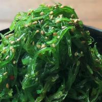 Kelp Salad · Light green marinated seaweed.