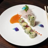 Raku Roll · Tuna, avocado, cucumber, Kaiware, crunch and scallion with kimchi sauce and wrapped with ric...