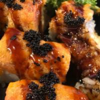 Sex On The Beach Roll · carb and shrimp tempura inside spicy tuna eel sauce black tobiko on top