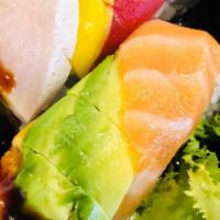 Obsess Roll · spicy tuna asparagus wrapped with tuna salmon yellow tail eel mango and avocado on top