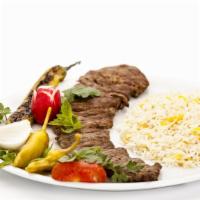 Lamb Over Rice · Lamb Gyro with rice, salad and white sauce.